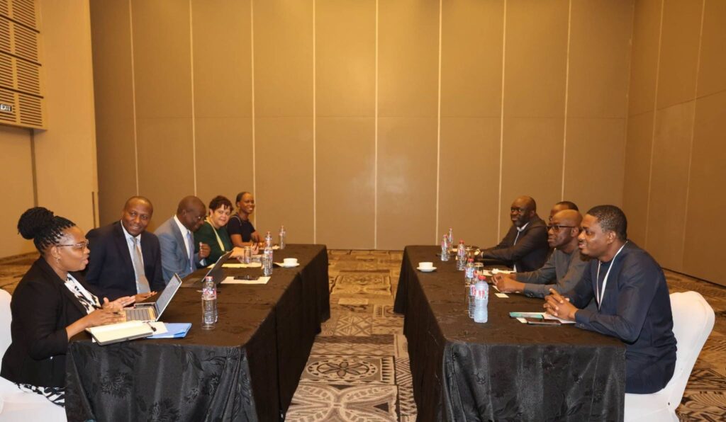 Prime Minister Russell Mmiso Dlamini and GNPC Chief Executive Officer Kwame Ntow Amoah face each other during bilateral discussions in Accra, Ghana, focused on knowledge exchange and potential cooperation between ENPC and GNPC.