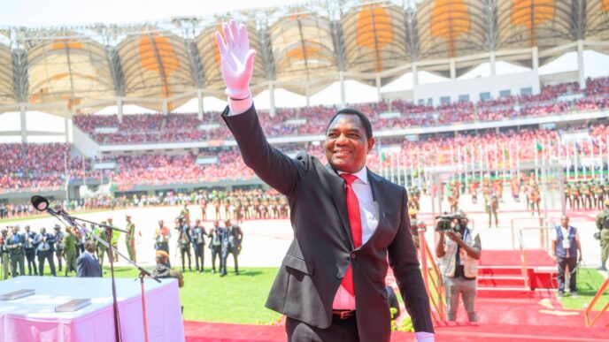 Zambian President Hakainde Hichilema waves to supporters at the National Heroes Stadium following his swearing in for a second term.