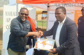Amos Zaindi presents the facility to Minister S’khumbuzo Dlamini. Photo: World Vision Eswatini