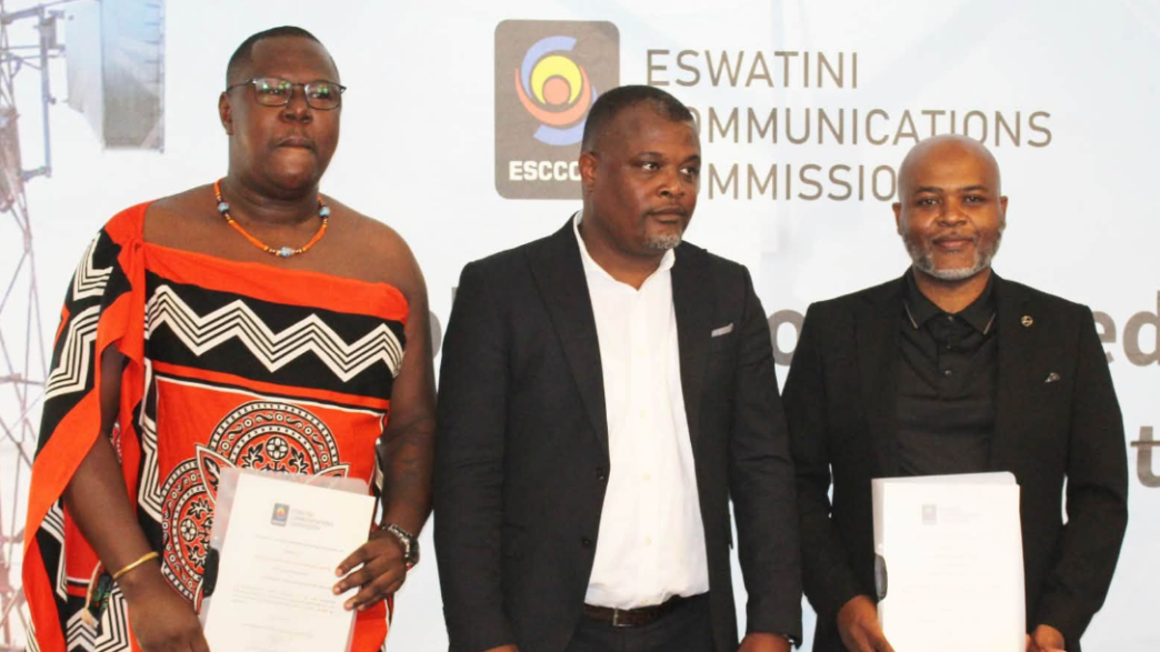Icon Connect Radio representative Phila Koshini and Sakha Live FM representative Melusi Dlamini pose with ESCCOM Acting Chief Executive Officer Ozzie Thakatha after receiving their commercial radio broadcasting licences