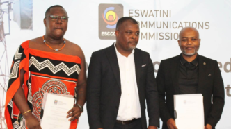 Icon Connect Radio representative Phila Koshini and Sakha Live FM representative Melusi Dlamini pose with ESCCOM Acting Chief Executive Officer Ozzie Thakatha after receiving their commercial radio broadcasting licences